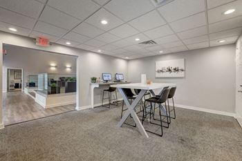 Apartments In Sandy Springs, GA for Rent – Celebration at Sandy Springs - business center with table and chairs and computers